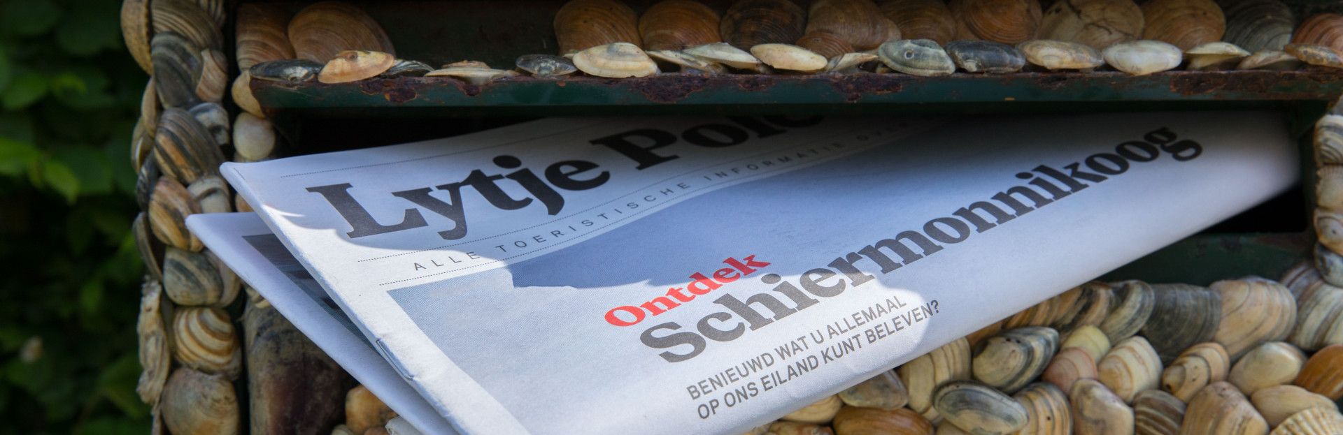 Lytje pole krant in de brievenbus